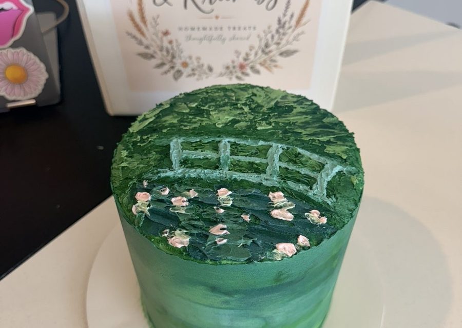 Green garden cake with a painted trellis and piped flowers