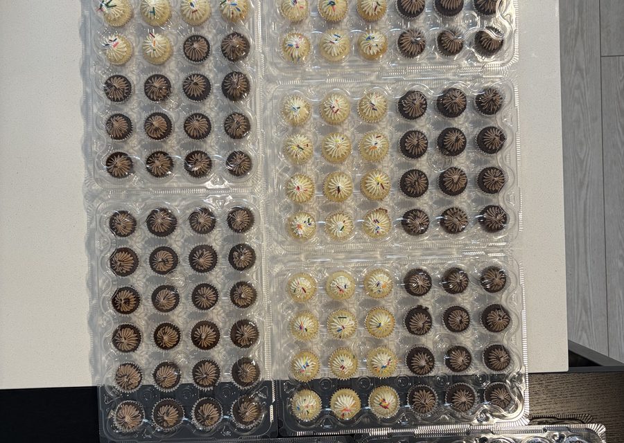 Trays of hand-dipped cake pops ready for an order