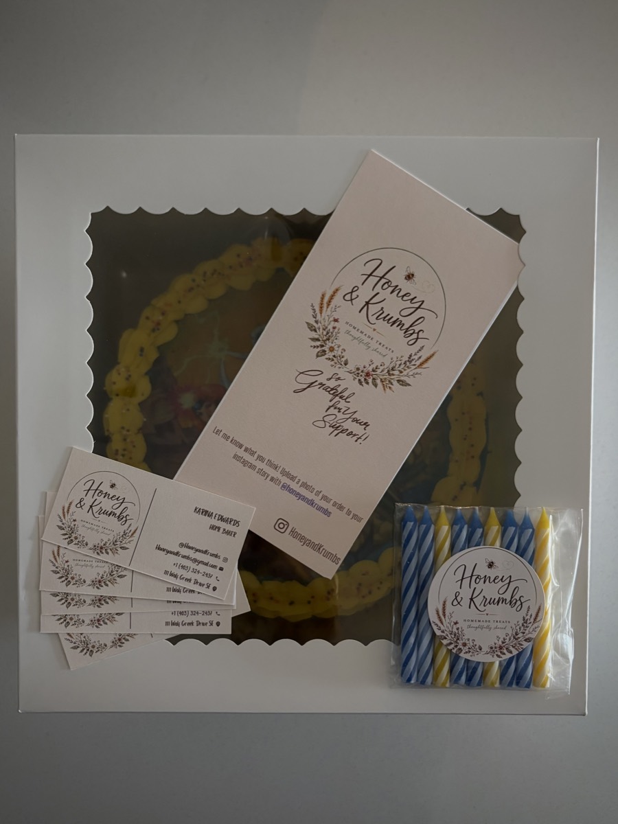 Honey & Krumbs cake box, thank-you card and birthday candles